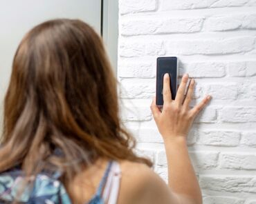 Smart building demonstration with a girl using fingerprint scan to open door